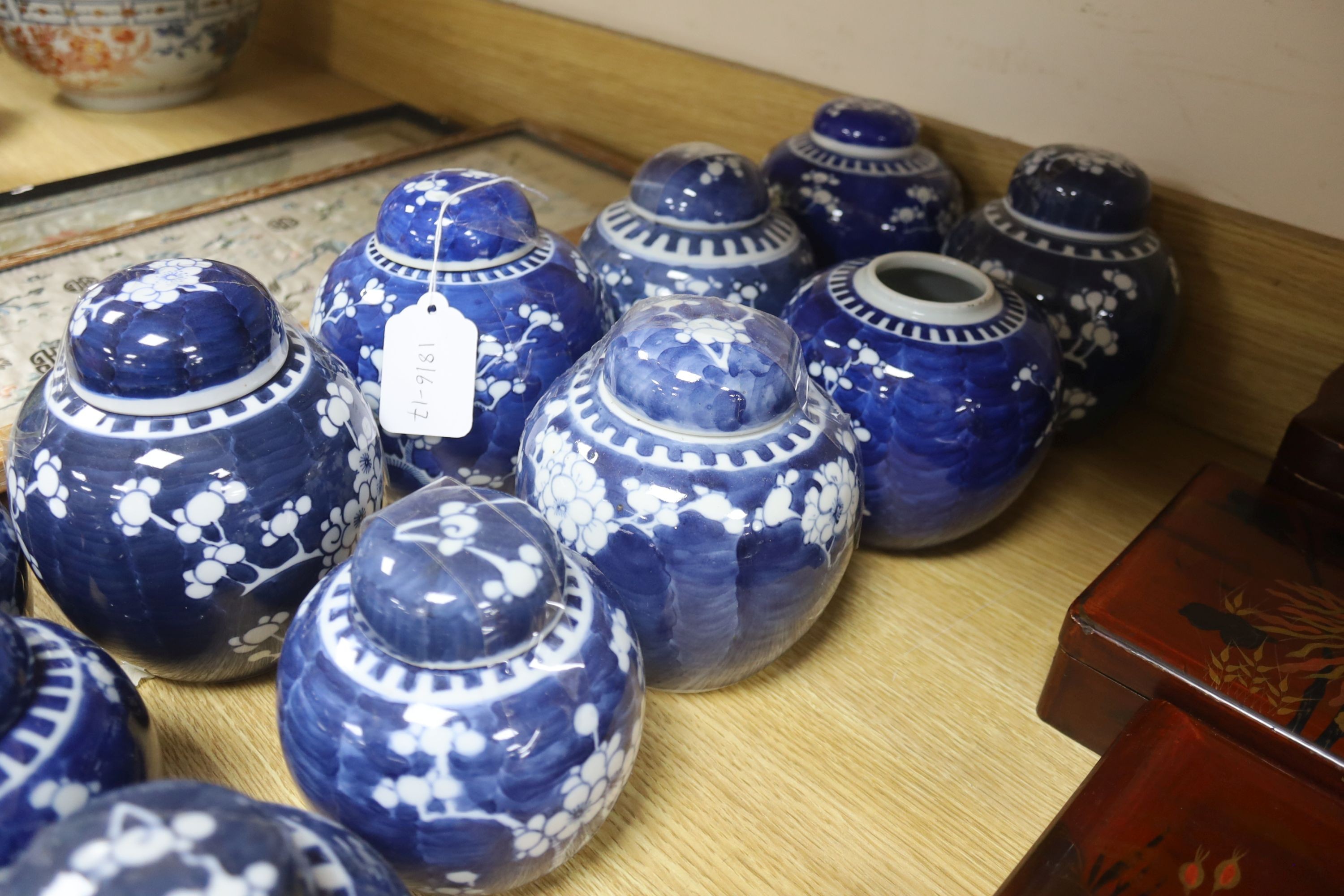 Fourteen Chinese blue and white prunus jars some with covers